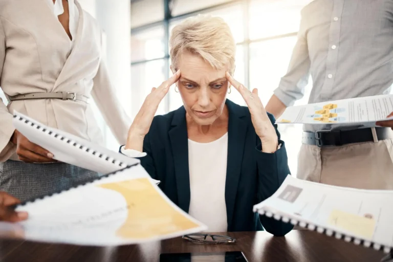 Business woman, stress, burnout and documents with staff question