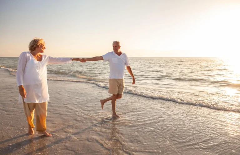 Happy-Senior-Couple-on-the-Beach-at-Sunset