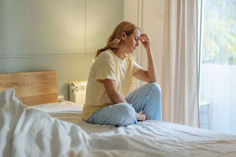 Woman On Bed Looking Tired