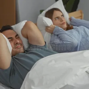 Couple Under Stress In Bed