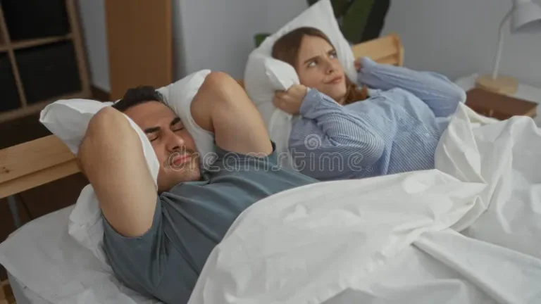 Couple Under Stress In Bed