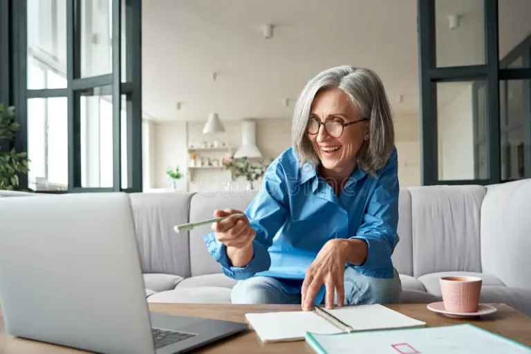 Mature Older Woman Looking at Computer